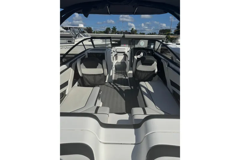 Slide: The Image of 2019 Yamaha Boats 242 Limited S interior with sleek seating and modern design. - 5