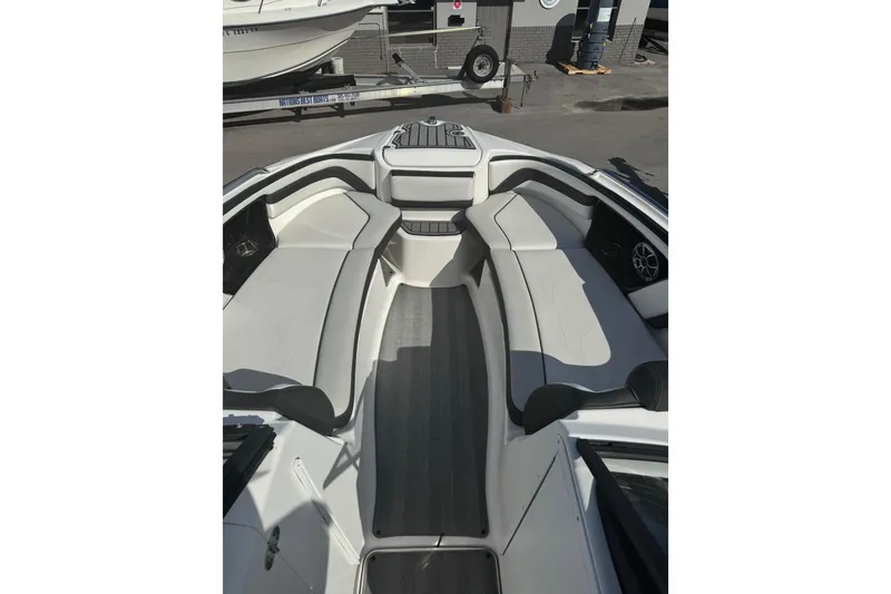 Slide: The Image of 2019 Yamaha Boats 242 Limited S interior with spacious seating and sleek design. - 7
