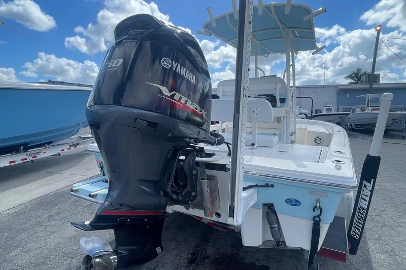 Slide: The Image of 2020 Pathfinder 2200 Tournament Edition boat with Yamaha VMAX outboard motor, docked under blue sky. - 3