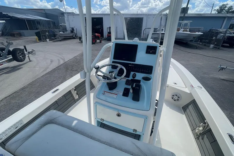 Slide: The Image of 2020 Pathfinder 2200 Tournament Edition boat console with steering wheel and controls. - 5