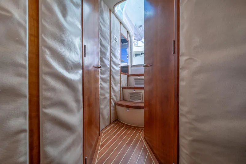 Slide: The Image of Interior view of 2011 SeaVee 430 Sport Express with wooden flooring and cabin doors. - 22