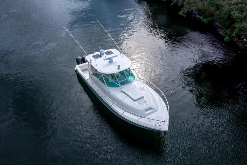 Slide: The Image of 2011 SeaVee 430 Sport Express boat on calm water, aerial view. - 5
