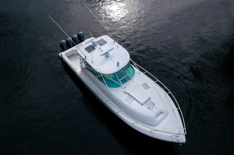 Slide: The Image of 2011 SeaVee 430 Sport Express boat on calm water, aerial view. - 9