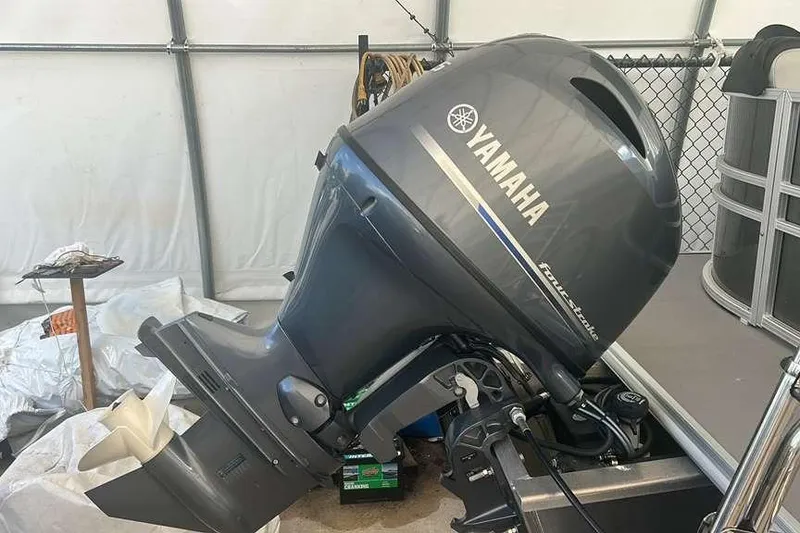 Slide: The Image of Yamaha outboard motor on 2023 Sylvan Mirage 820 LZ boat in storage. - 2