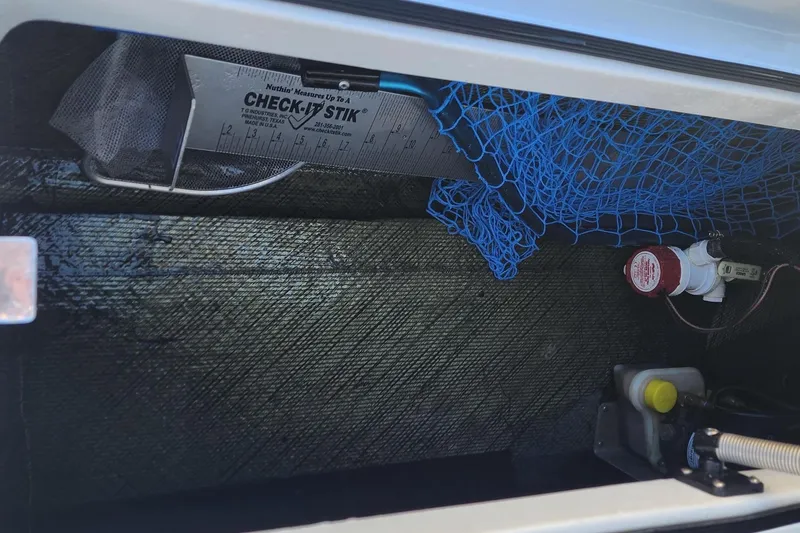 Slide: The Image of Storage compartment of 2022 East Cape Vantage VHP with fishing gear and equipment. - 10