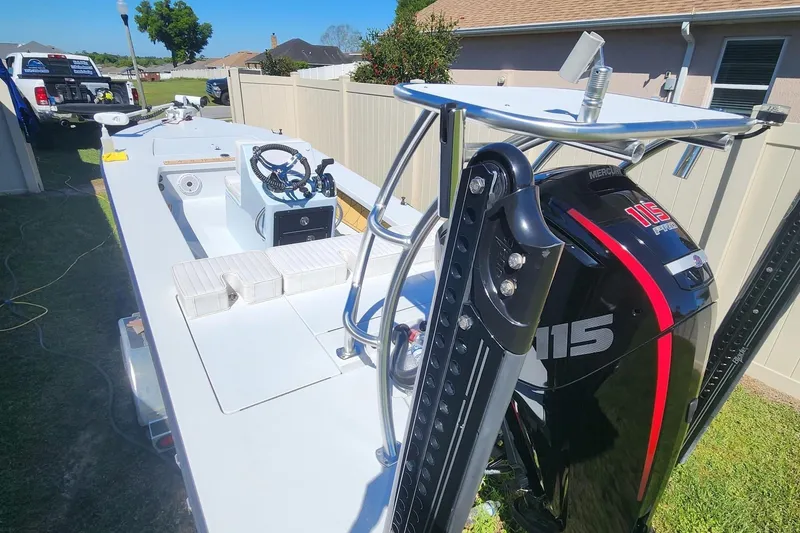 Slide: The Image of 2022 East Cape Vantage VHP boat with Mercury 115 Pro XS engine, parked outdoors. - 5