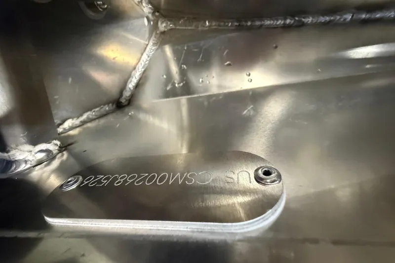 Slide: The Image of Close-up of metal plate with engraved serial number on 2026 Crest Conquest 230 SLSC. - 17