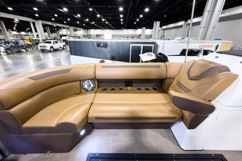 Slide: The Image of Luxurious interior of 2026 Montara Surf Boss EVO SL 23' boat with tan leather seating. - 10