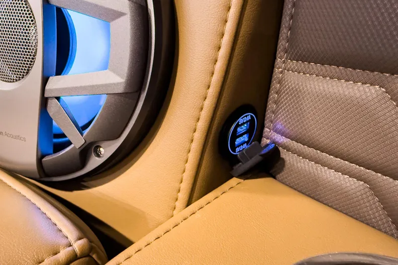 Slide: The Image of 2026 Montara Surf Boss EVO SL 23' interior with speaker and USB port detail. - 12