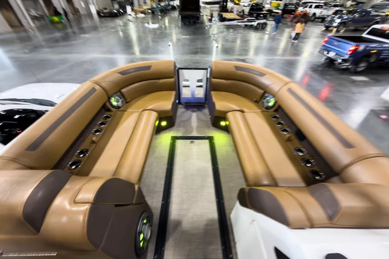 Slide: The Image of Luxurious interior of 2026 Montara Surf Boss EVO SL 23' boat with brown seating. - 13