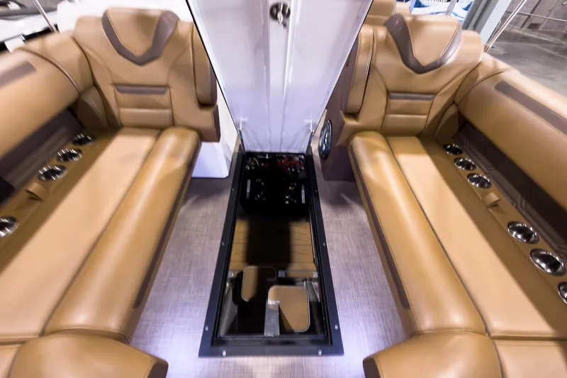 Slide: The Image of Luxurious interior of 2026 Montara Surf Boss EVO SL 23' with tan leather seating. - 14