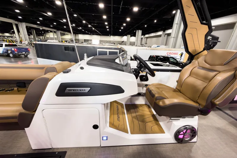 Slide: The Image of 2026 Montara Surf Boss EVO SL 23' boat interior with luxurious seating and modern dashboard. - 16