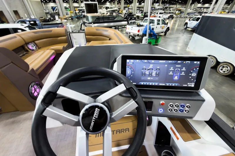 Slide: The Image of Interior view of 2026 Montara Surf Boss EVO SL 23' boat with modern dashboard and touchscreen display. - 17