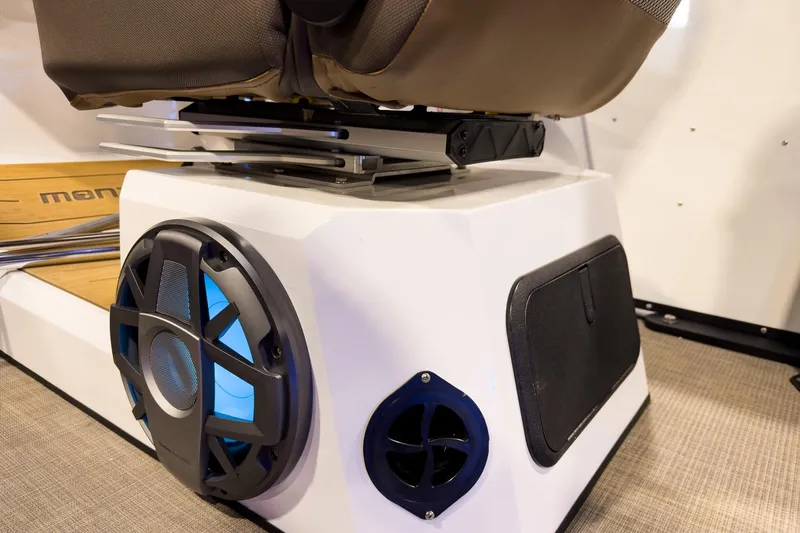 Slide: The Image of 2026 Montara Surf Boss EVO SL 23' boat interior with speaker and seating detail. - 19