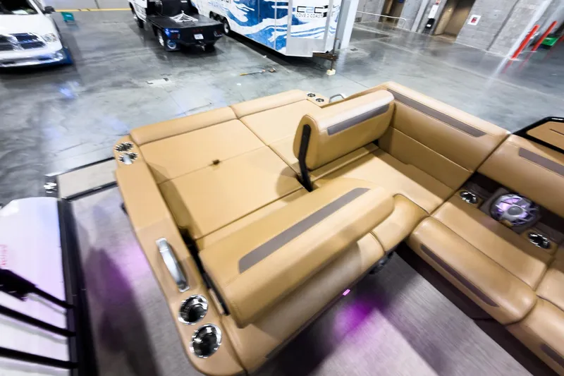 Slide: The Image of Luxurious interior of 2026 Montara Surf Boss EVO SL 23' boat with tan seating. - 20