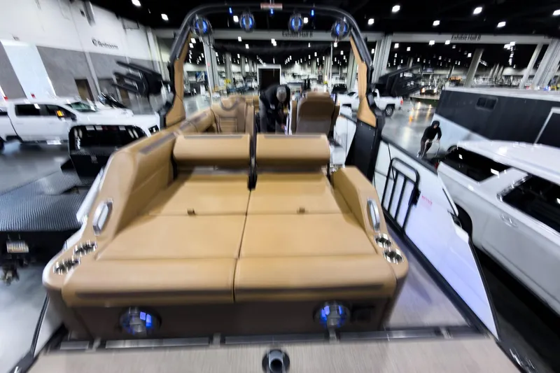 Slide: The Image of 2026 Montara Surf Boss EVO SL 23' boat interior at an indoor exhibition. - 22