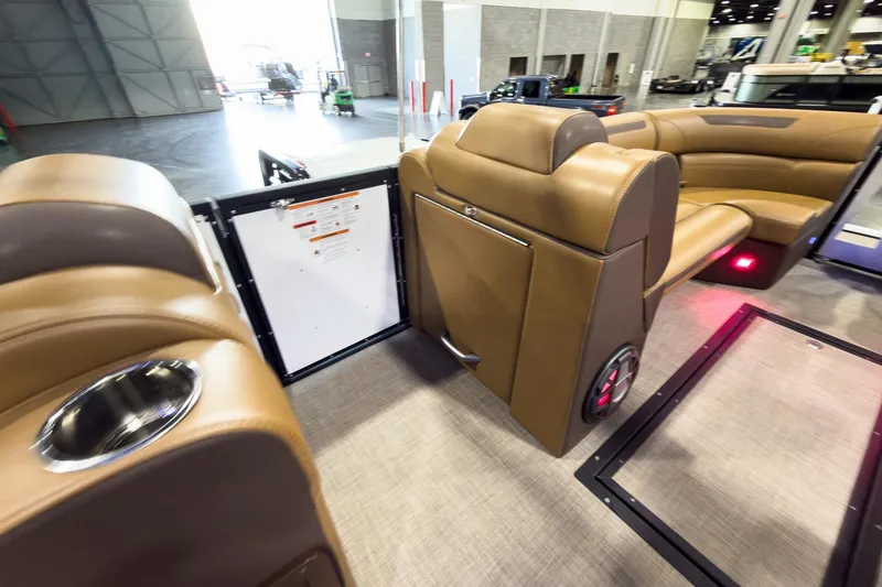 Slide: The Image of Luxurious interior of 2026 Montara Surf Boss EVO SL 23' boat with tan leather seating. - 23