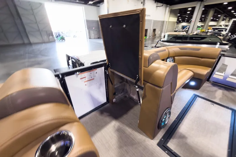 Slide: The Image of 2026 Montara Surf Boss EVO SL 23' interior with luxurious brown seating and modern design. - 24