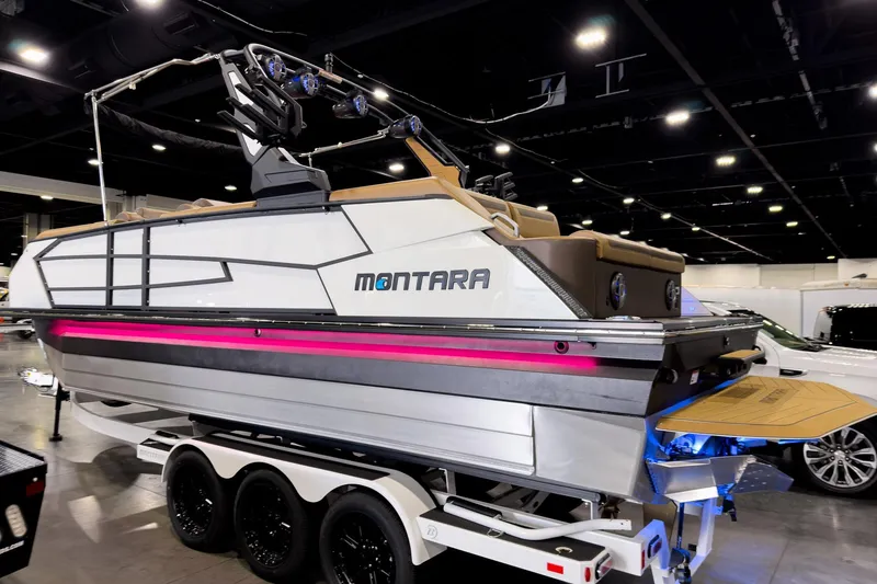 Slide: The Image of 2026 Montara Surf Boss EVO SL 23' boat displayed indoors with vibrant lighting. - 32