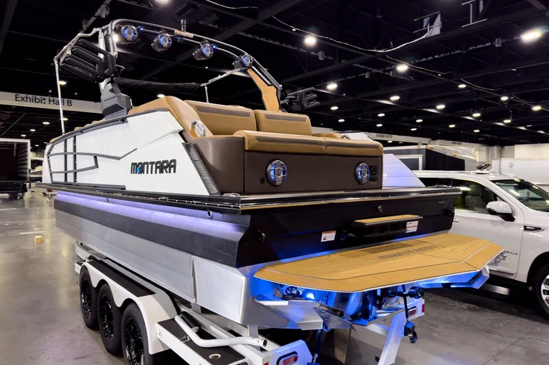Slide: The Image of 2026 Montara Surf Boss EVO SL 23' boat displayed indoors, featuring sleek design and modern amenities. - 5