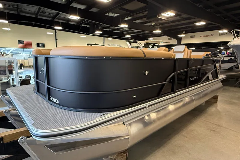 Slide: The Image of 2026 Crest Conquest 230 SLSC pontoon boat displayed indoors, featuring sleek black design. - 4