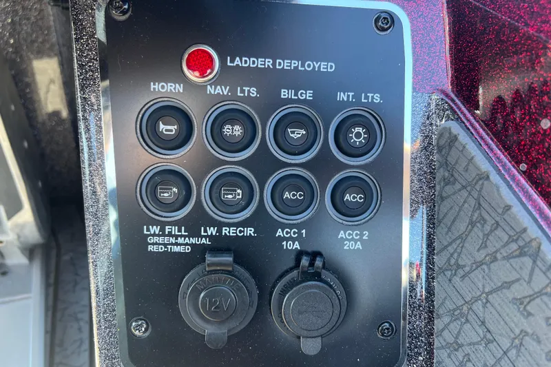 Slide: The Image of Control panel of 2026 Vexus VXS20 boat with various switches and indicators. - 13