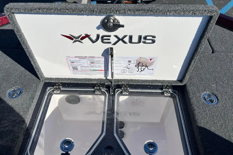 Slide: The Image of 2026 Vexus VXS20 boat livewell compartment with logo and operation instructions. - 21
