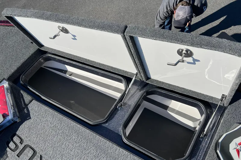 Slide: The Image of Open storage compartments on a 2026 Vexus VXS20 boat deck. - 9