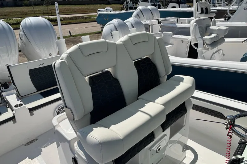 Slide: The Image of 2026 Tidewater 2700 Carolina Bay boat seating with stylish black and white upholstery. - 11