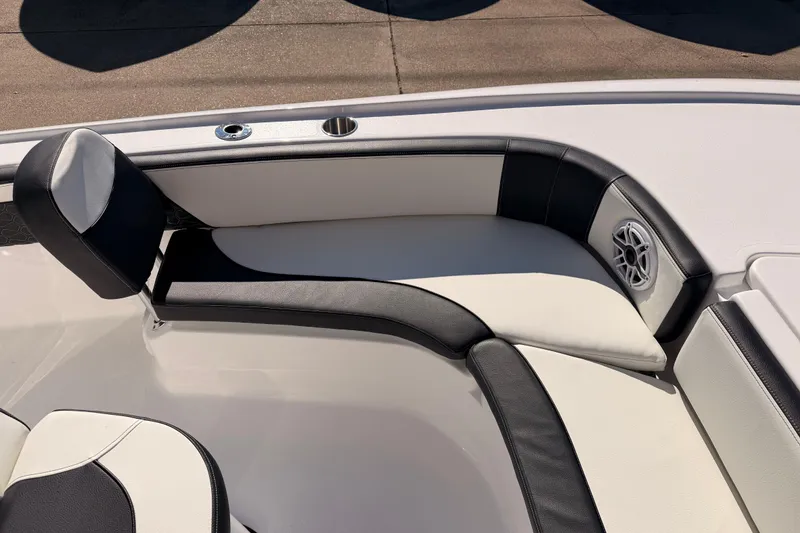 Slide: The Image of 2026 Tidewater 2700 Carolina Bay boat interior with cushioned seating and speaker. - 18
