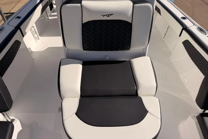 Slide: The Image of 2026 Tidewater 2700 Carolina Bay boat interior with black and white cushioned seating. - 20