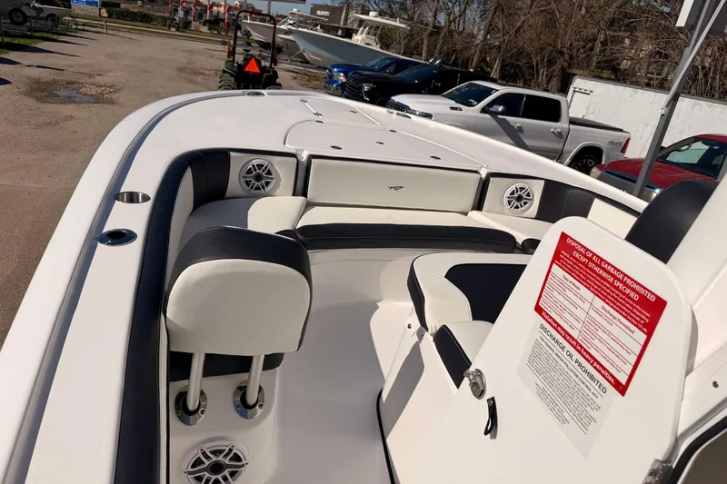 Slide: The Image of 2026 Tidewater 2700 Carolina Bay boat interior with seating and speakers. - 21