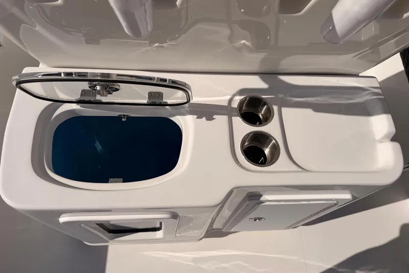 Slide: The Image of Tidewater 2700 Carolina Bay 2026 boat compartment with stainless steel openings. - 22