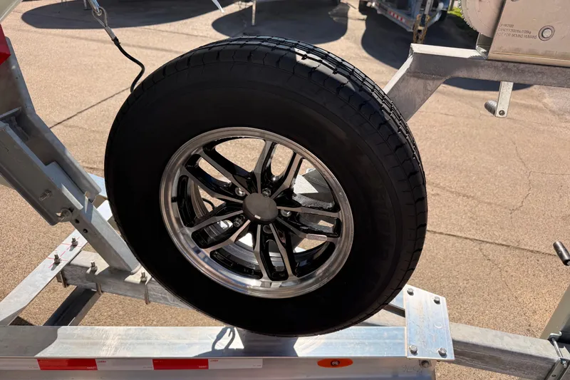 Slide: The Image of Trailer wheel for 2026 Tidewater 2700 Carolina Bay boat on metal frame. - 26