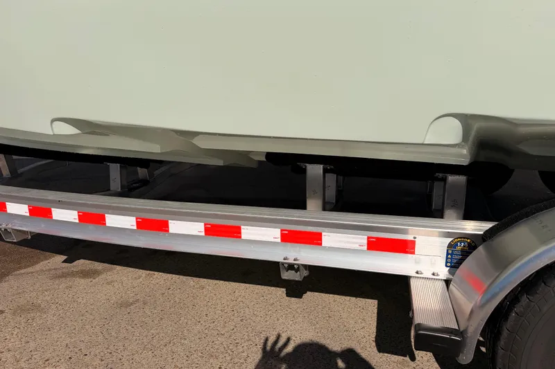 Slide: The Image of 2026 Tidewater 2700 Carolina Bay boat on trailer, close-up view. - 29