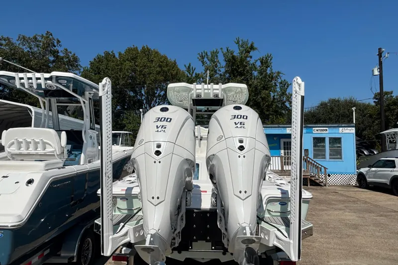 Slide: The Image of 2026 Tidewater 2700 Carolina Bay boat on trailer at dealership lot. - 4