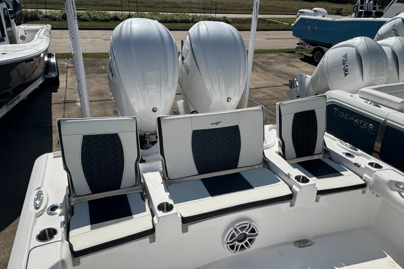 Slide: The Image of 2026 Tidewater 2700 Carolina Bay boat displayed at a yacht sales dealership. - 6