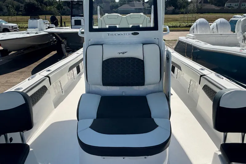 Slide: The Image of 2026 Tidewater 2700 Carolina Bay boat on trailer, featuring Yamaha engine, outdoor display. - 9