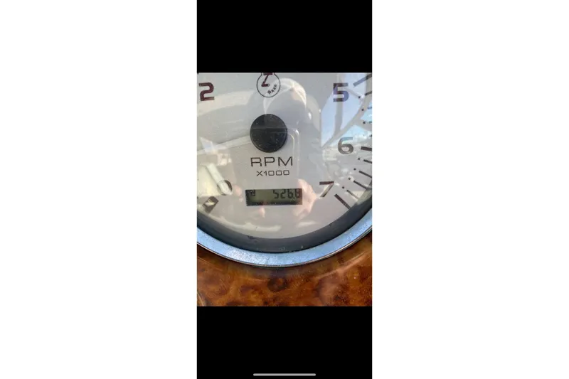 Slide: The Image of Close-up of 2004 Rinker Fiesta Vee 342 RPM gauge showing 5268 RPM. - 12