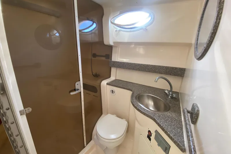 Slide: The Image of 2004 Rinker Fiesta Vee 342 bathroom with sink, toilet, and shower. - 17