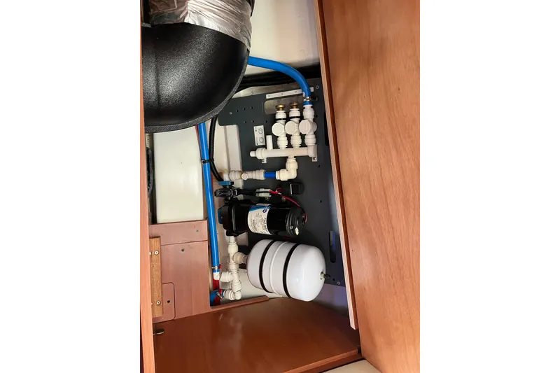 Slide: The Image of Plumbing system inside 2020 Beneteau Oceanis 46.1 yacht, featuring pipes and fittings. - 51