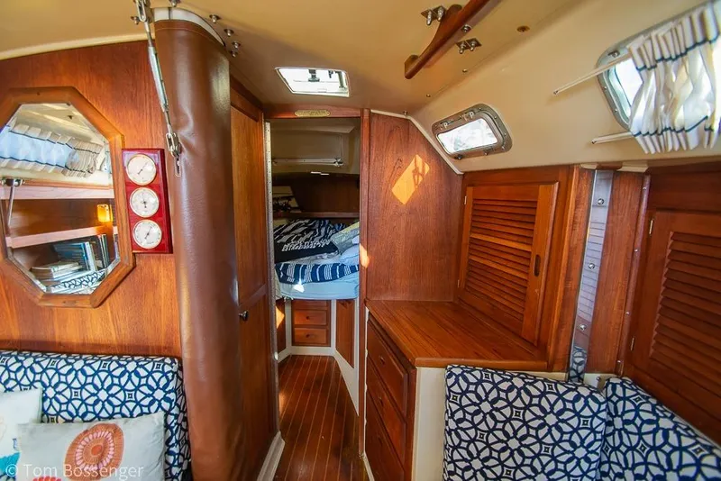 Slide: The Image of Interior of a 1985 Catalina 36 sailboat with wood paneling and cozy cabin. - 18