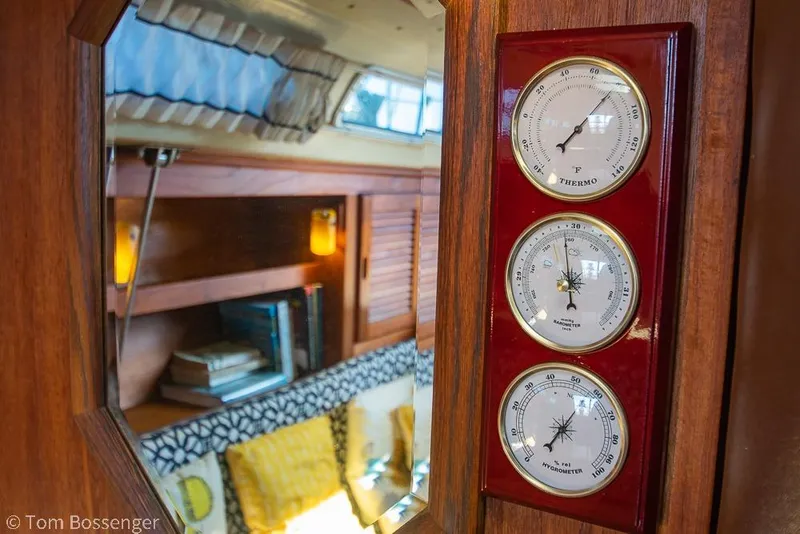 Slide: The Image of Interior of 1985 Catalina 36 yacht with wooden paneling and weather instruments. - 19