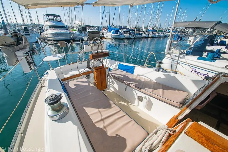 Slide: The Image of Cockpit view of a 1985 Catalina 36 sailboat docked in a marina. - 24