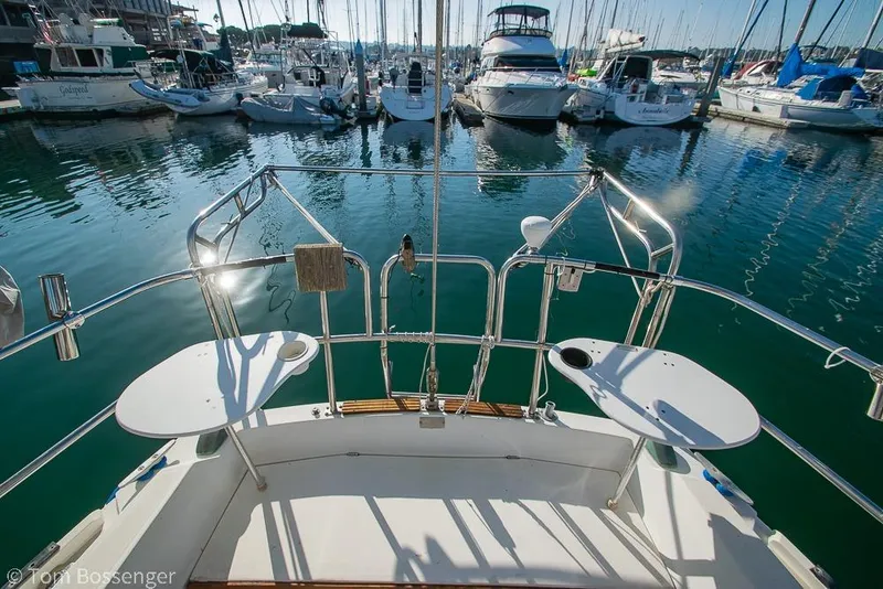 Slide: The Image of Cockpit view of 1985 Catalina 36 sailboat docked in a marina. - 25