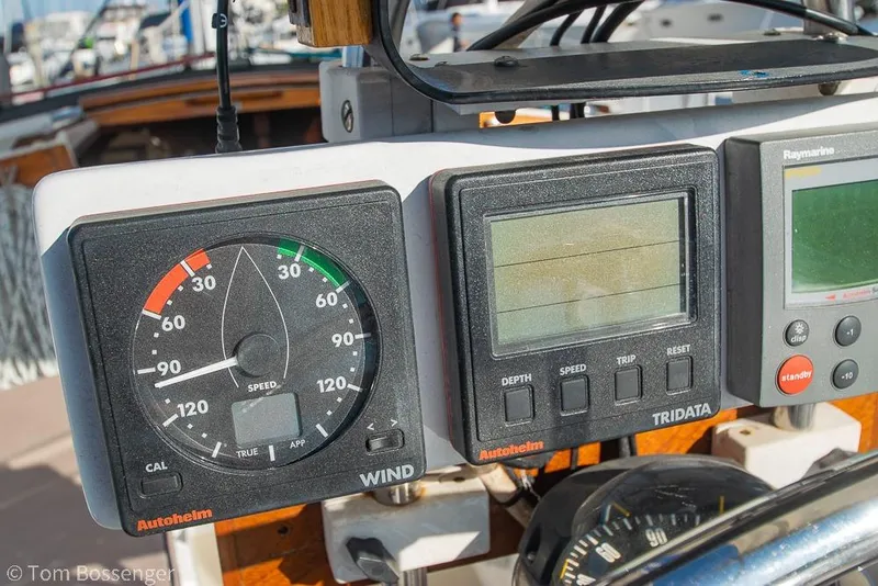 Slide: The Image of Close-up of 1985 Catalina 36 sailboat's navigation instruments, featuring Autohelm and Raymarine displays. - 30