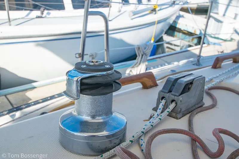 Slide: The Image of Winch and cleat on 1985 Catalina 36 sailboat deck, with ropes and railing. - 35