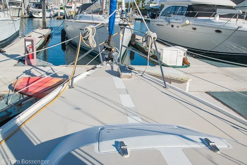 Slide: The Image of 1985 Catalina 36 sailboat docked at marina with other boats. - 37