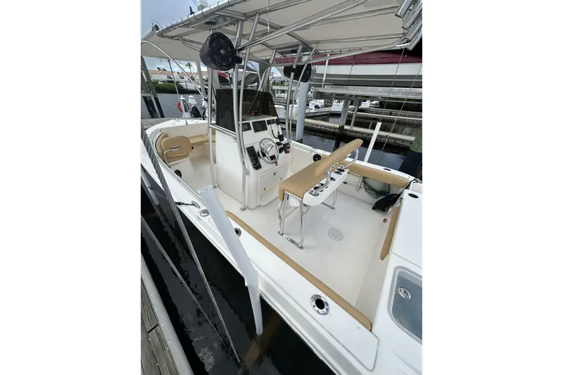 Slide: The Image of 2019 Cobia 220 Center Console boat with spacious deck and modern controls. - 7