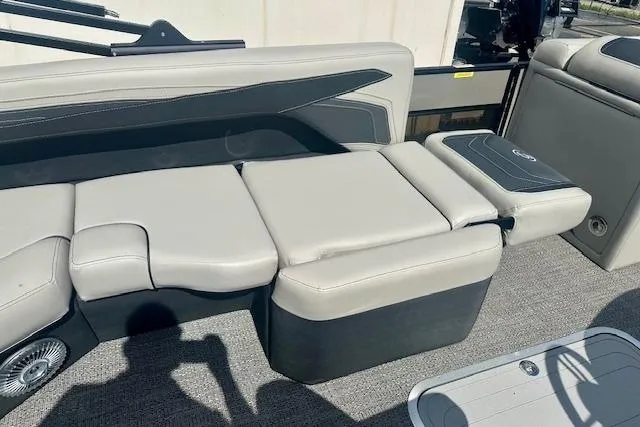 Slide: The Image of 2026 Barletta C22M pontoon boat interior with gray cushioned seating and modern design. - 10